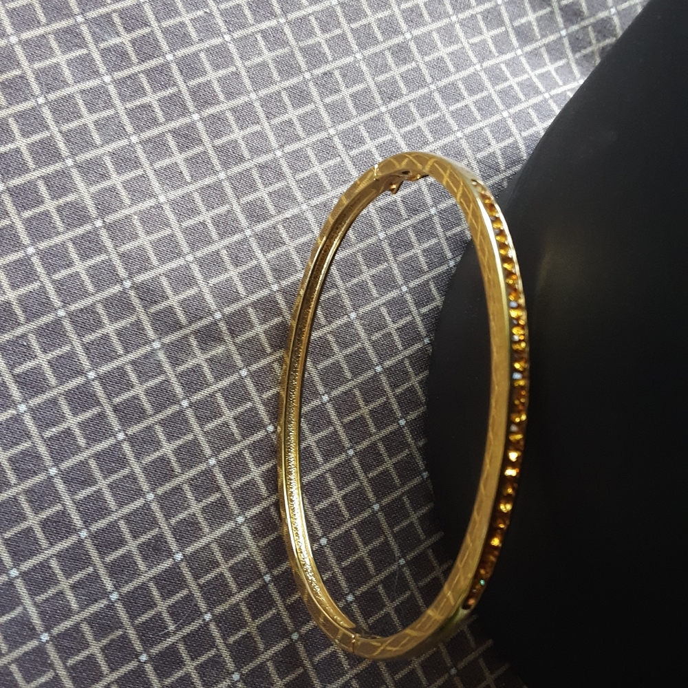 bangle gold tone braclet with small crystal stones in an citrine color